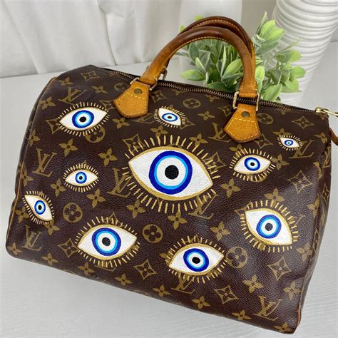 louis vuitton evil eye|louis vuitton football player.